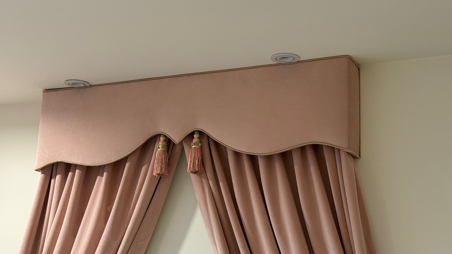 Shaped blush upholstered cornice and drapery in Beverly Hills condominium