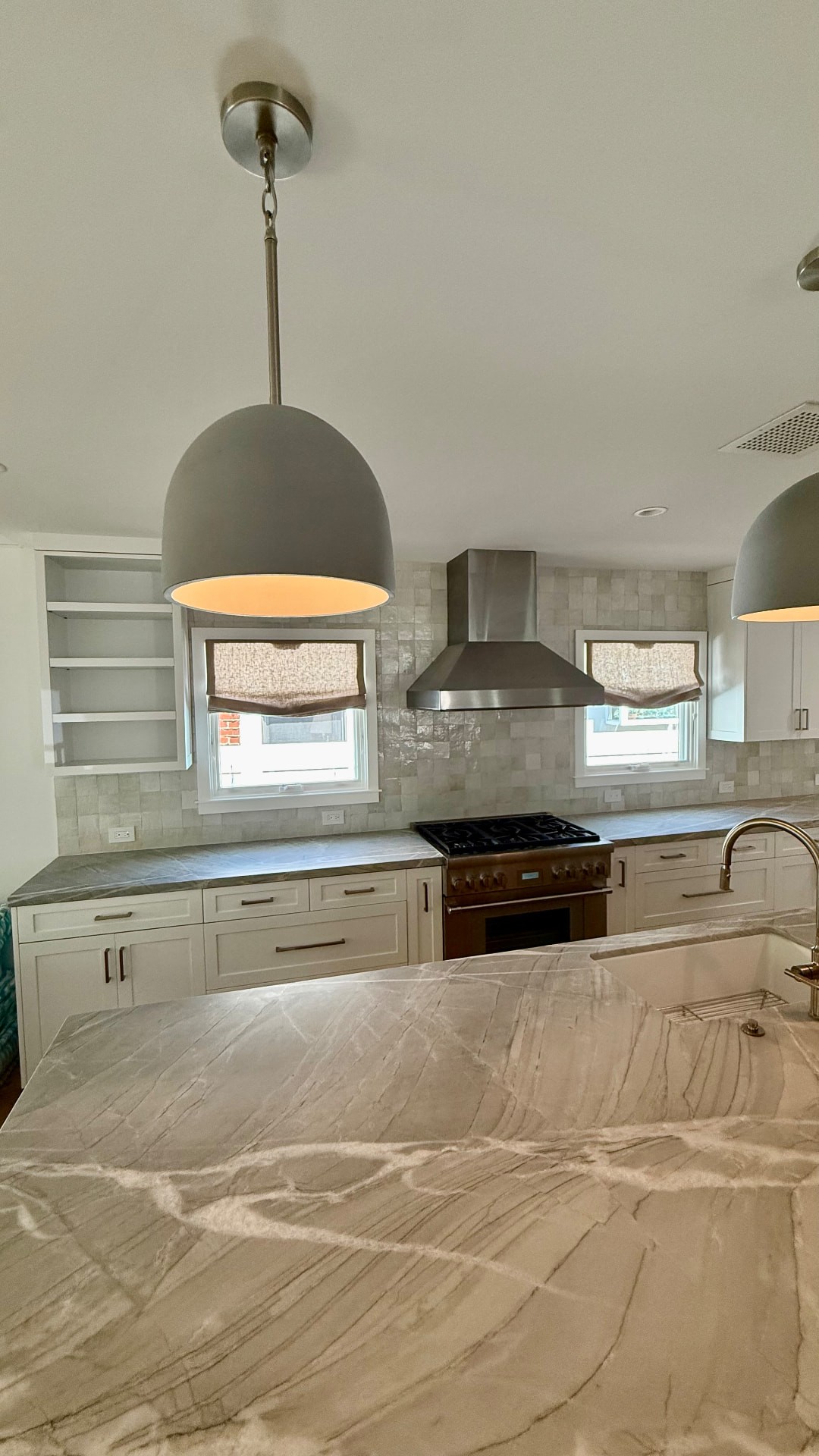 Cordless linen Roman shades in Venice Beach house kitchen