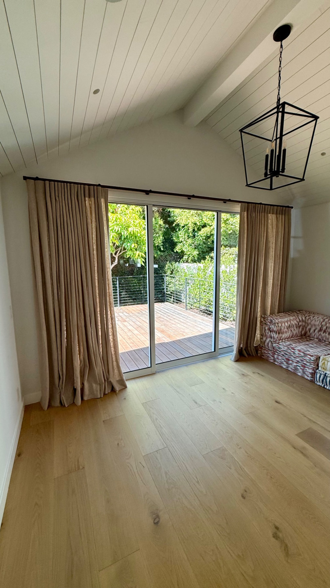 Custom linen drapery on bronze hybrid rod track at Venice Beach house