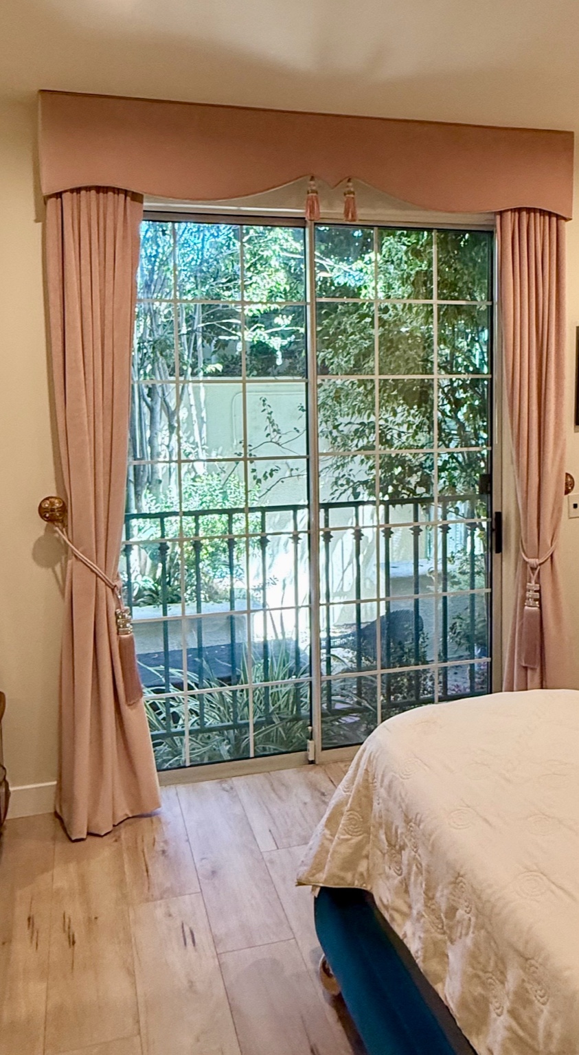 Blush pink drapery and shaped upholstered cornice in Beverly Hills primary suite